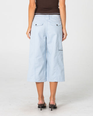 Woman wearing It Gyrl Low Rise Capri Cargo Pant in Pastel Blue