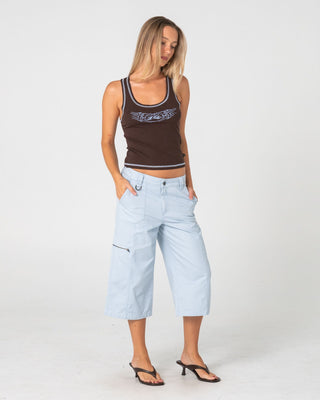Woman wearing It Gyrl Low Rise Capri Cargo Pant in Pastel Blue