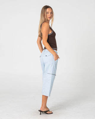 Woman wearing It Gyrl Low Rise Capri Cargo Pant in Pastel Blue