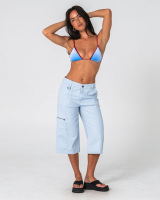 Woman wearing It Gyrl Low Rise Capri Cargo Pant in Pastel Blue