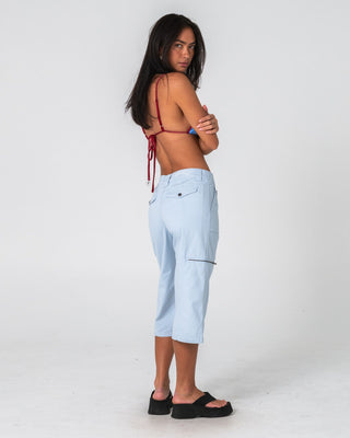Woman wearing It Gyrl Low Rise Capri Cargo Pant in Pastel Blue