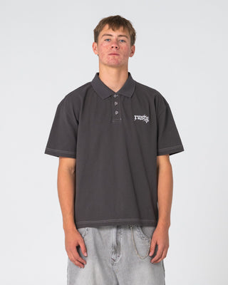 Man wearing Cleetus Short Sleeve Polo in Carbon