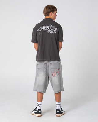 Man wearing Cleetus Short Sleeve Polo in Carbon