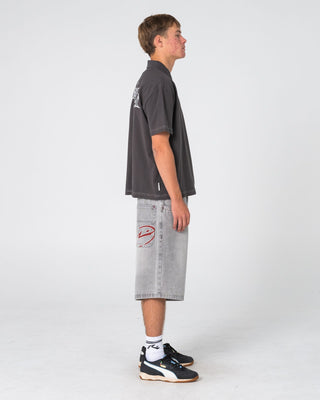 Man wearing Cleetus Short Sleeve Polo in Carbon