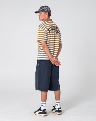 Man wearing Cleetus Short Sleeve Polo in Mushroom
