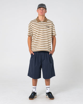 Man wearing Cleetus Short Sleeve Polo in Mushroom