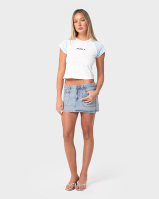 Woman wearing Alley Low Rise Denim Mini Skirt in True Blue