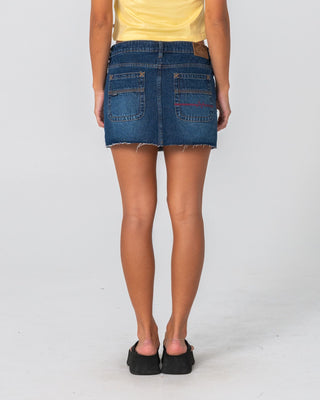 Woman wearing Mavericks Low Rise Denim Mini Skirt 2.0 in Blasted Deep Sea Blue
