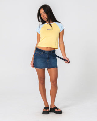 Woman wearing Mavericks Low Rise Denim Mini Skirt 2.0 in Blasted Deep Sea Blue