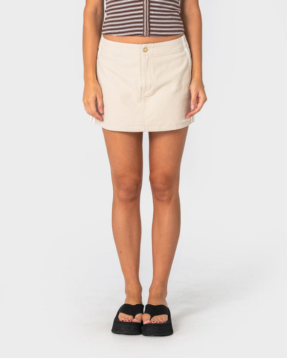 woman-wearing-payload-low-rise-mini-skirt-in-oatmeal