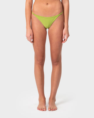 Woman wearing Shadow Ring Cheeky Bikini Bottom in Sublime Green