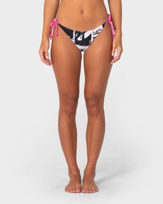 Woman wearing Graff Town Brazilian Tie Bikini Bottom in Mono / Pink