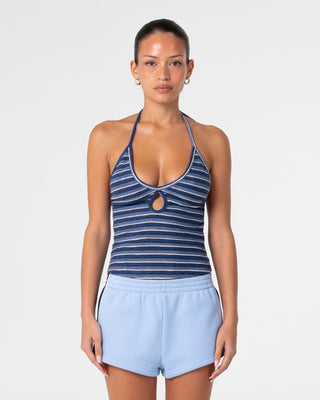 Woman wearing Emma Cut Out Skimmer Tank in Blue Stripe