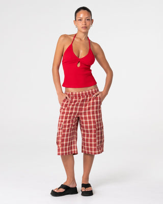 Woman wearing Emma Cut Out Skimmer Tank in Red 2
