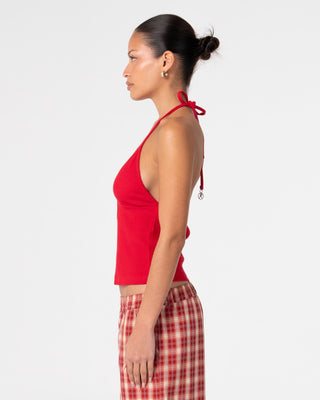 Woman wearing Emma Cut Out Skimmer Tank in Red 2