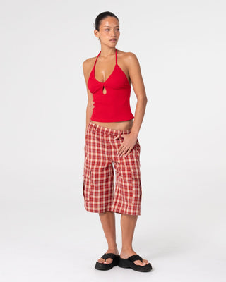 Woman wearing Emma Cut Out Skimmer Tank in Red 2