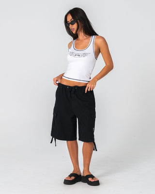 Woman wearing Dirrty Racer Tank in White