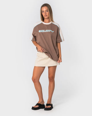 Woman wearing Timmy Target 220 Oversize Tee in Mushroom / Aqua