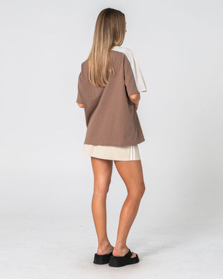 Woman wearing Timmy Target 220 Oversize Tee in Mushroom / Aqua