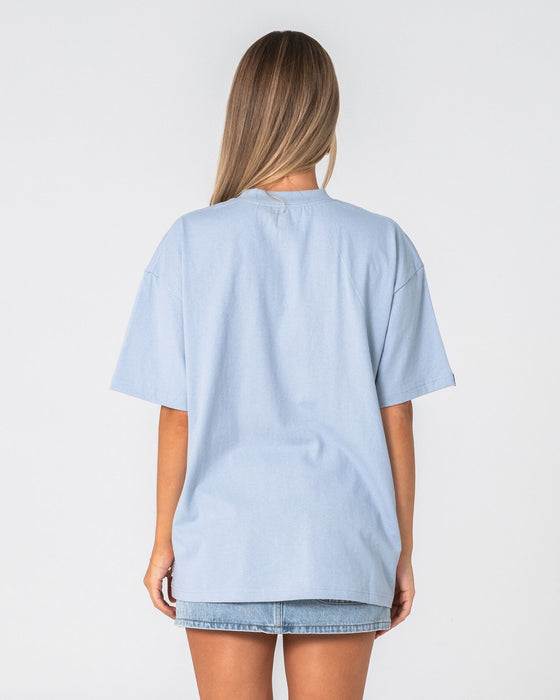 woman-wearing-wavers-tide-oversize-short-sleeve-tee-in-retro-blue-white