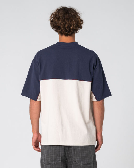 man-wearing-infinity-short-sleeve-tee-in-cream