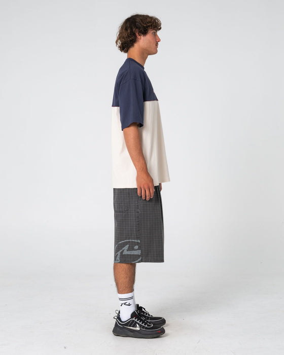 man-wearing-infinity-short-sleeve-tee-in-cream
