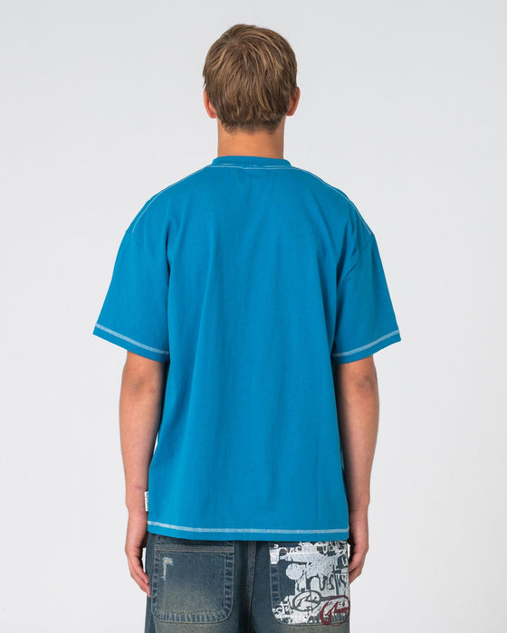 man-wearing-bus-down-short-sleeve-tee-in-petrol-blue