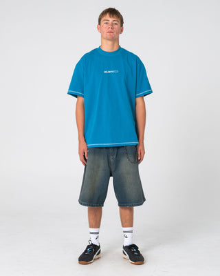 Man wearing Bus Down Short Sleeve Tee in Petrol Blue