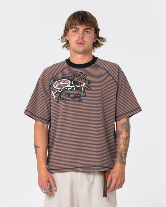 man-wearing-riddle-me-this-short-sleeve-tee-in-pinecone