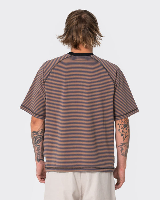 man-wearing-riddle-me-this-short-sleeve-tee-in-pinecone