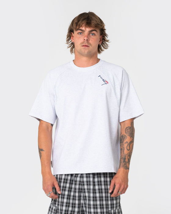 man-wearing-avalanche-short-sleeve-tee-in-ecru-marle
