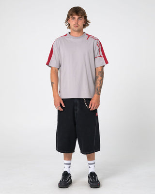 Man wearing Lost It Short Sleeve Tee in Stone Grey