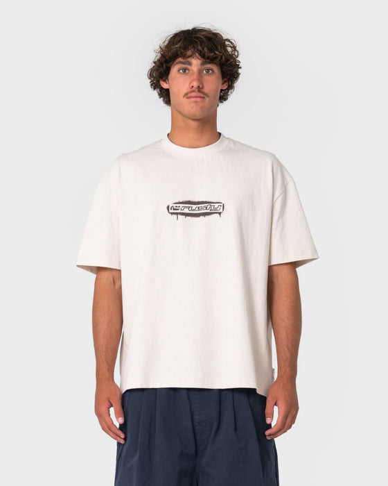 man-wearing-can-o-paint-short-sleeve-tee-in-cream
