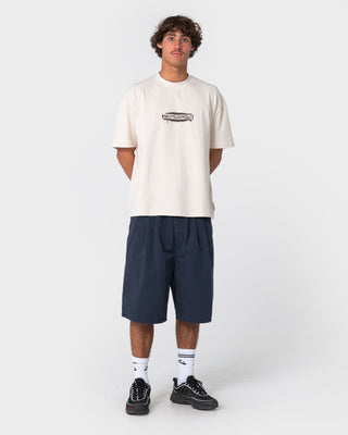 man-wearing-can-o-paint-short-sleeve-tee-in-cream