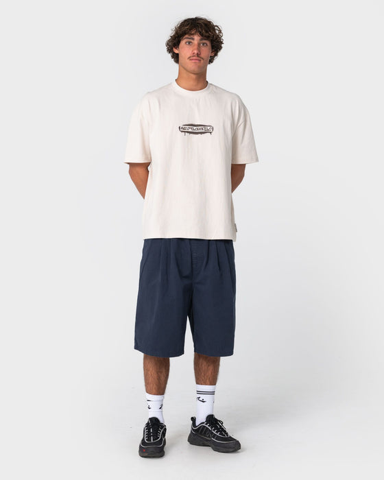 man-wearing-can-o-paint-short-sleeve-tee-in-cream