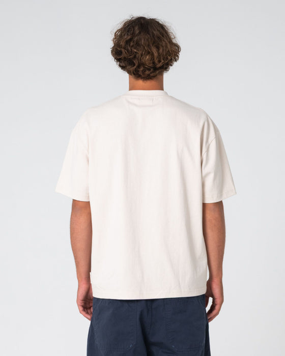 man-wearing-can-o-paint-short-sleeve-tee-in-cream