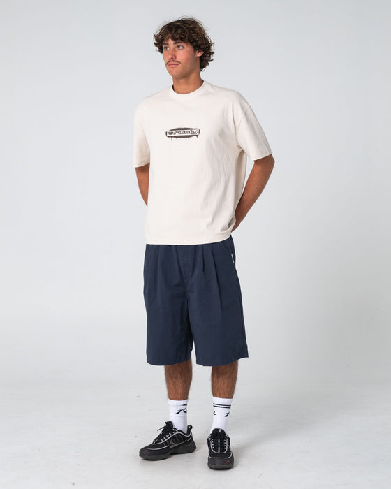 man-wearing-can-o-paint-short-sleeve-tee-in-cream