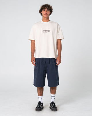Man wearing Can O Paint Short Sleeve Tee in Cream
