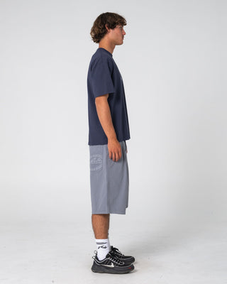 Man wearing Can O Paint Short Sleeve Tee in Dark Blue