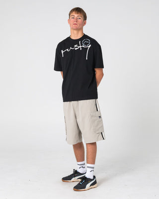 Man wearing Kurban Sprawl Short Sleeve Tee in Black