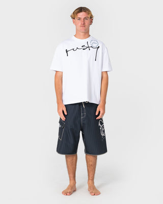 Man wearing Kurban Sprawl Short Sleeve Tee in White
