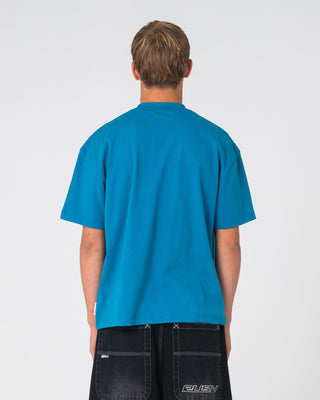 Man wearing Picky Short Sleeve Tee in Petrol Blue