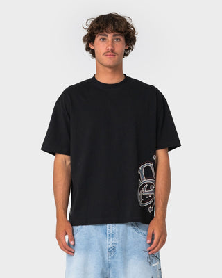 Man wearing Art Attack Short Sleeve Tee in Black