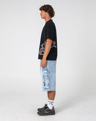 Man wearing Art Attack Short Sleeve Tee in Black
