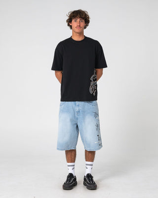 Man wearing Art Attack Short Sleeve Tee in Black