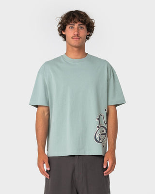 Man wearing Art Attack Short Sleeve Tee in Seafoam