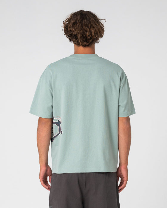man-wearing-art-attack-short-sleeve-tee-in-seafoam