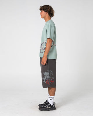 Man wearing Art Attack Short Sleeve Tee in Seafoam