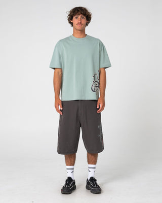 Man wearing Art Attack Short Sleeve Tee in Seafoam