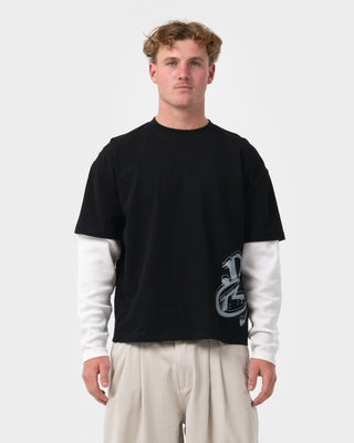 Man wearing Trackside Mock Long Sleeve Tee in Black